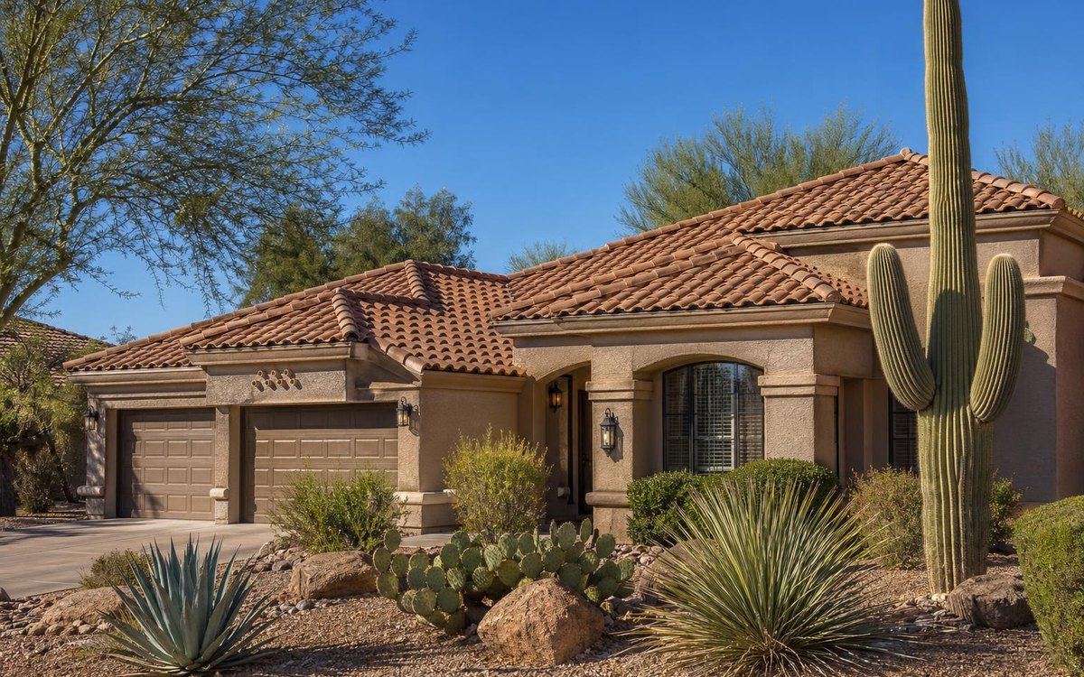 Arizona home with a clay tile roof and desert landscaping